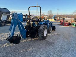 New Holland TC30 Tractor, bucket & backhoe 2278 hrs., SN 324596 on bucket