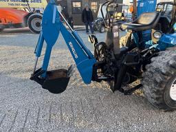 New Holland TC30 Tractor, bucket & backhoe 2278 hrs., SN 324596 on bucket