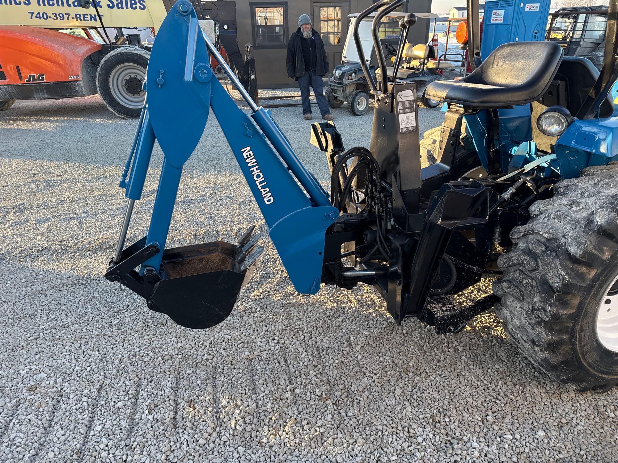 New Holland TC30 Tractor, bucket & backhoe 2278 hrs., SN 324596 on bucket