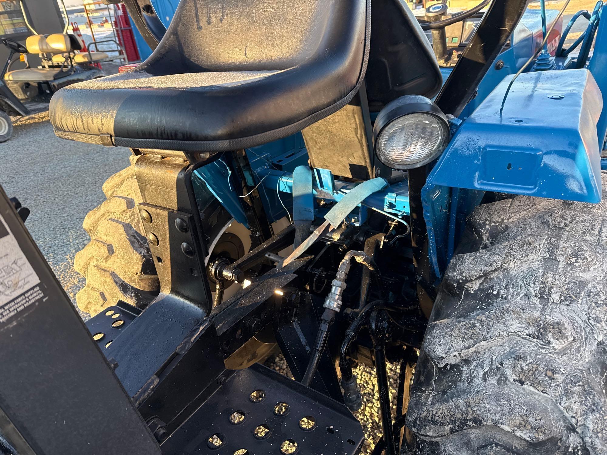 New Holland TC30 Tractor, bucket & backhoe 2278 hrs., SN 324596 on bucket
