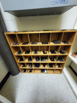 Office chair, wood cubby w. letters/numbers, area