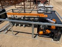 Unused skid steer trencher.