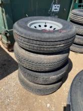 4 used 235/80R 16 trailer tires on 8 lug wheels. Pulled off auction trailer. Sold as 1 lot.