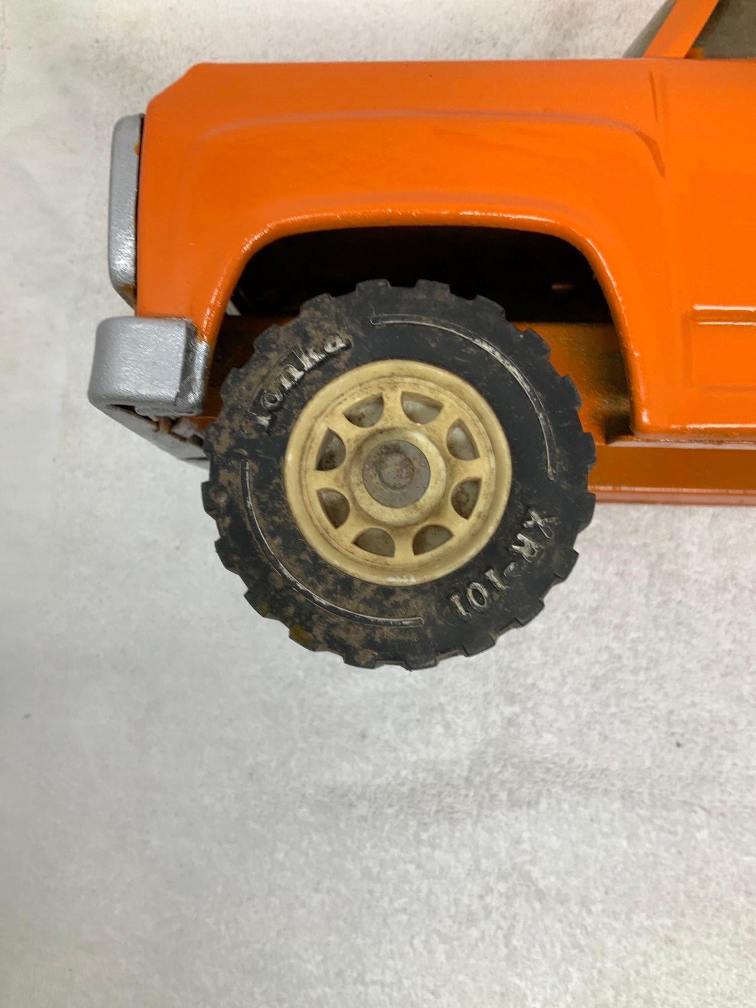 Vintage Tonka pressed steel orange dump truck