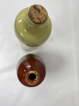 Two vintage crock bottles