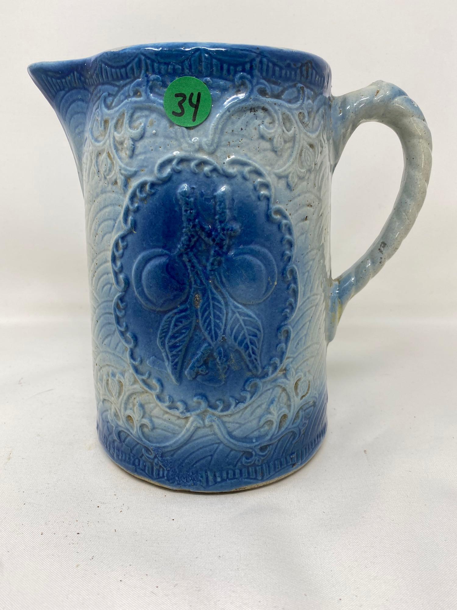 Vintage blue and white stoneware pitcher with fruit