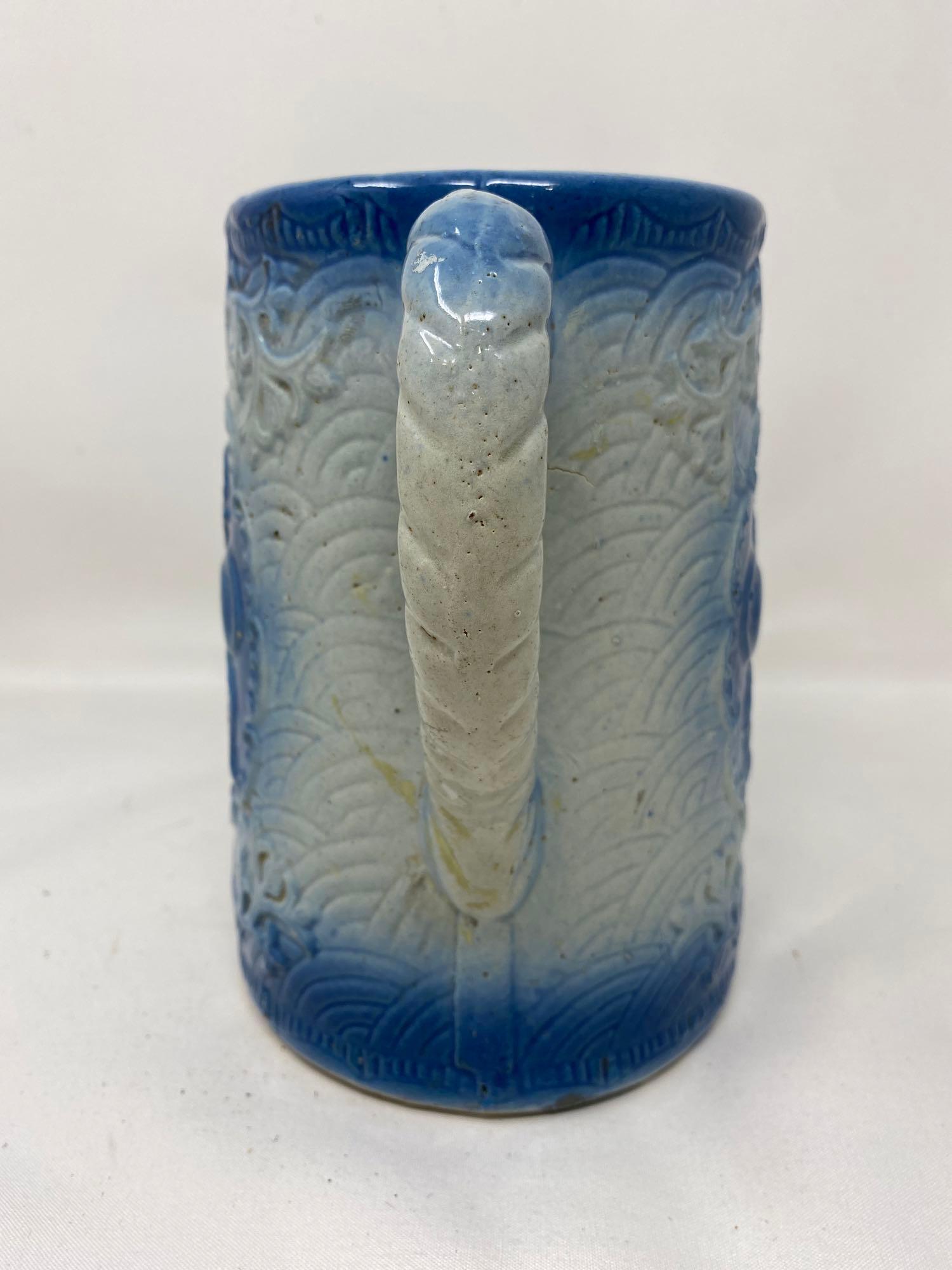 Vintage blue and white stoneware pitcher with fruit