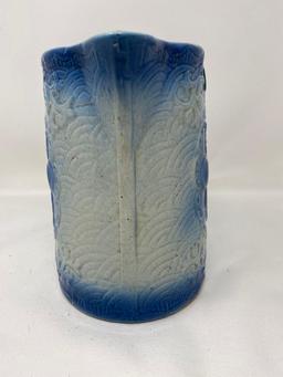 Vintage blue and white stoneware pitcher with fruit