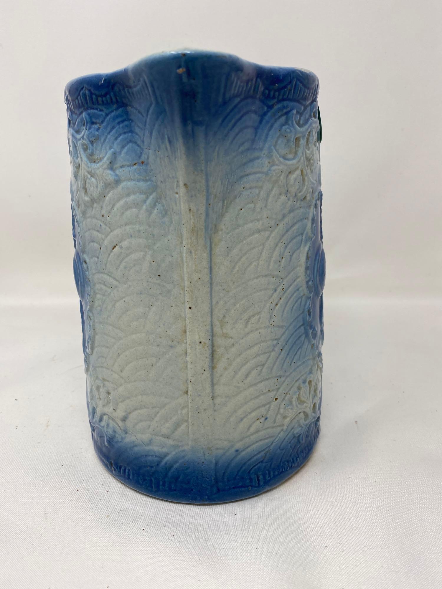 Vintage blue and white stoneware pitcher with fruit