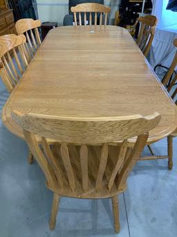 Oak table w/ 6 chairs and 2 leaves 7ft 10 in