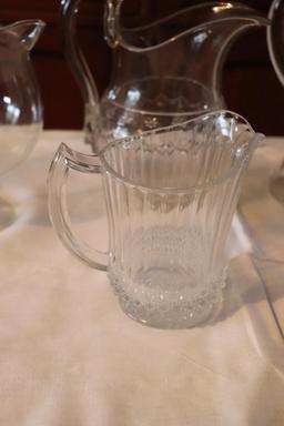 Quantity of clear glass pitchers