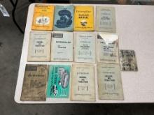 Flat of early Caterpillar and John Deere manuals