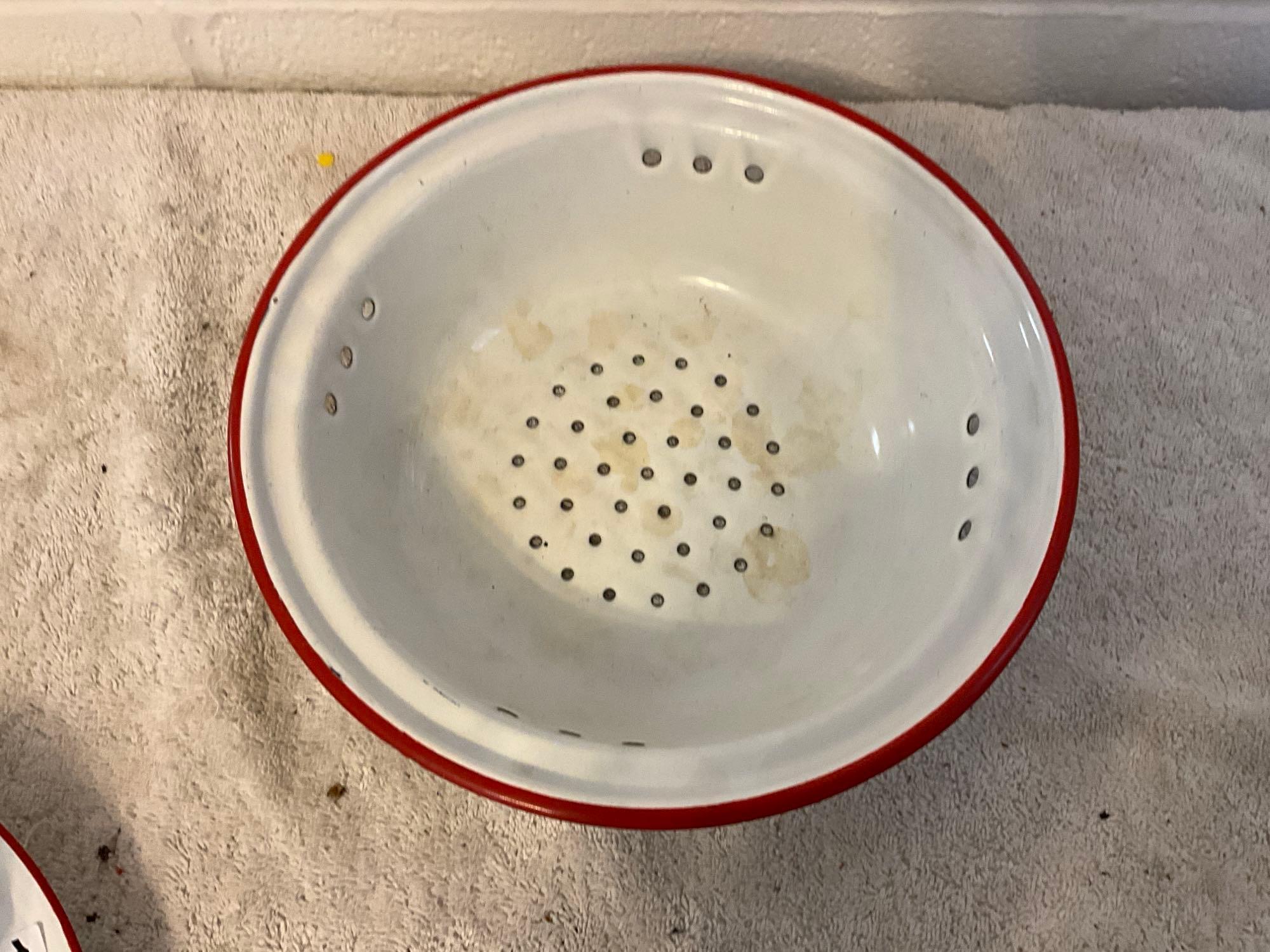 assortment of white w/red enamel skillet, plates, cups, & bowls