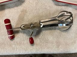 white w/red enamel casseroles, meat platter, & kitchen utensils