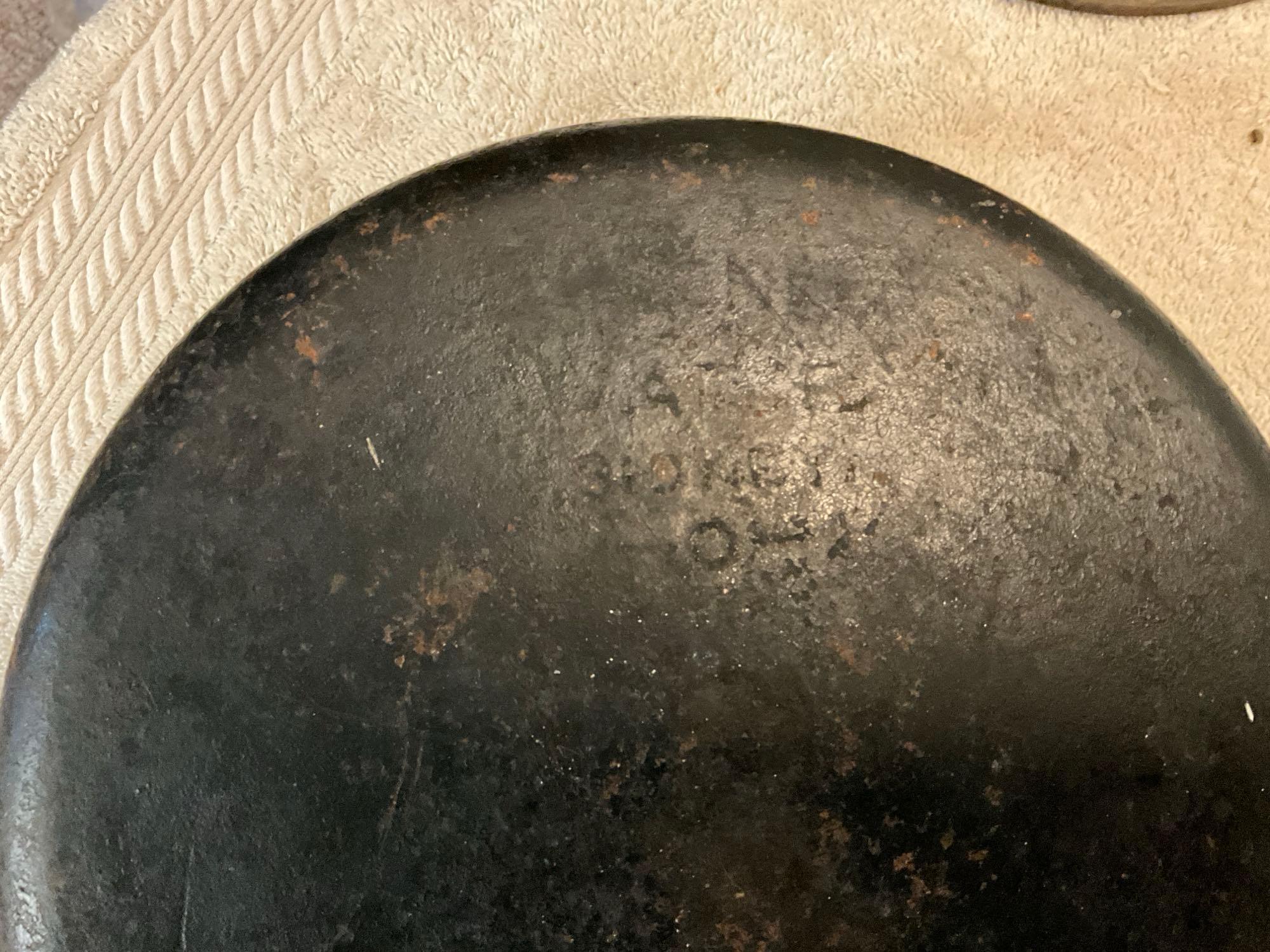 cast iron trivet, & (2) Dutch ovens, (1) lid missing