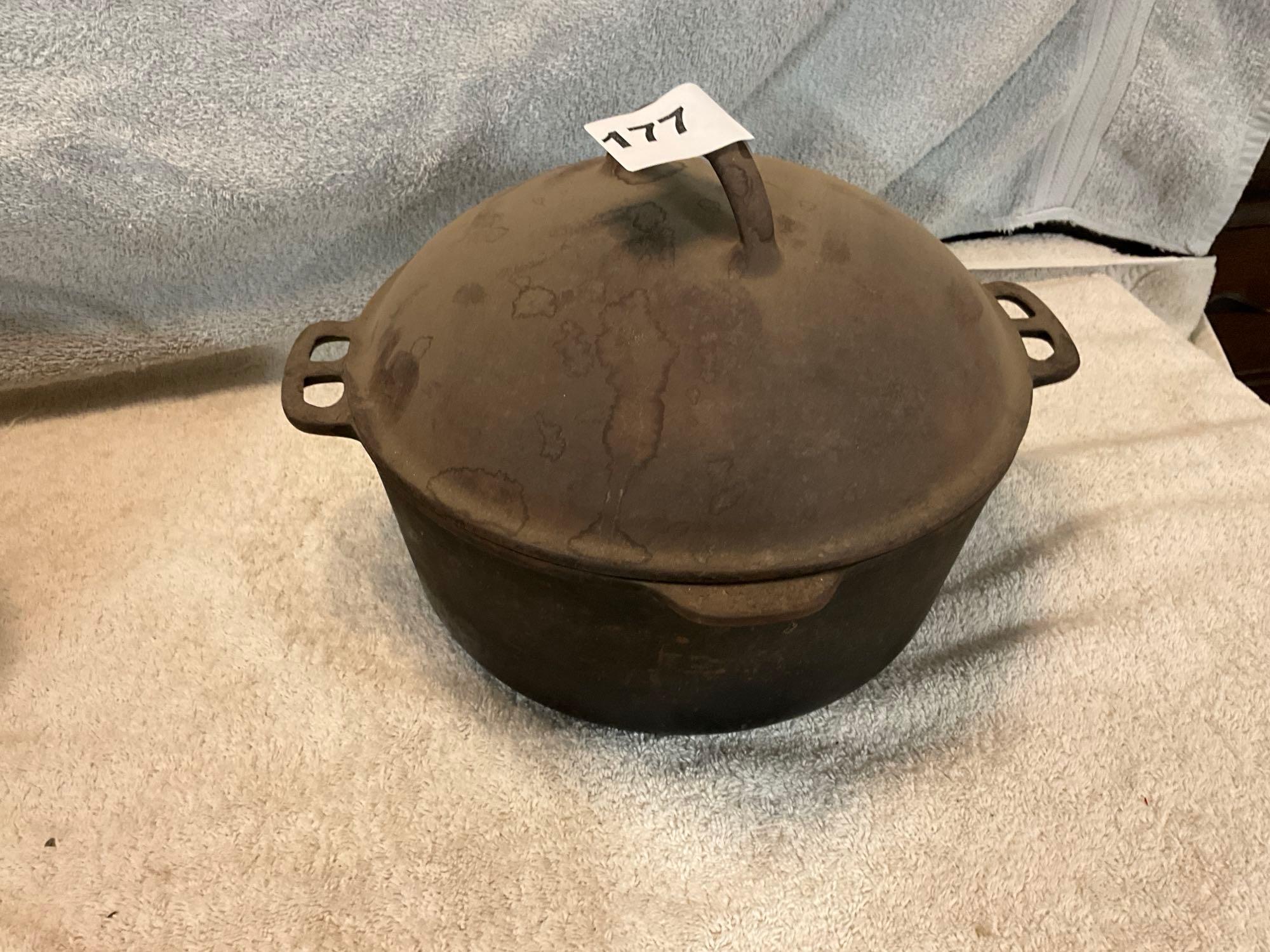 cast iron trivet, & (2) Dutch ovens, (1) lid missing