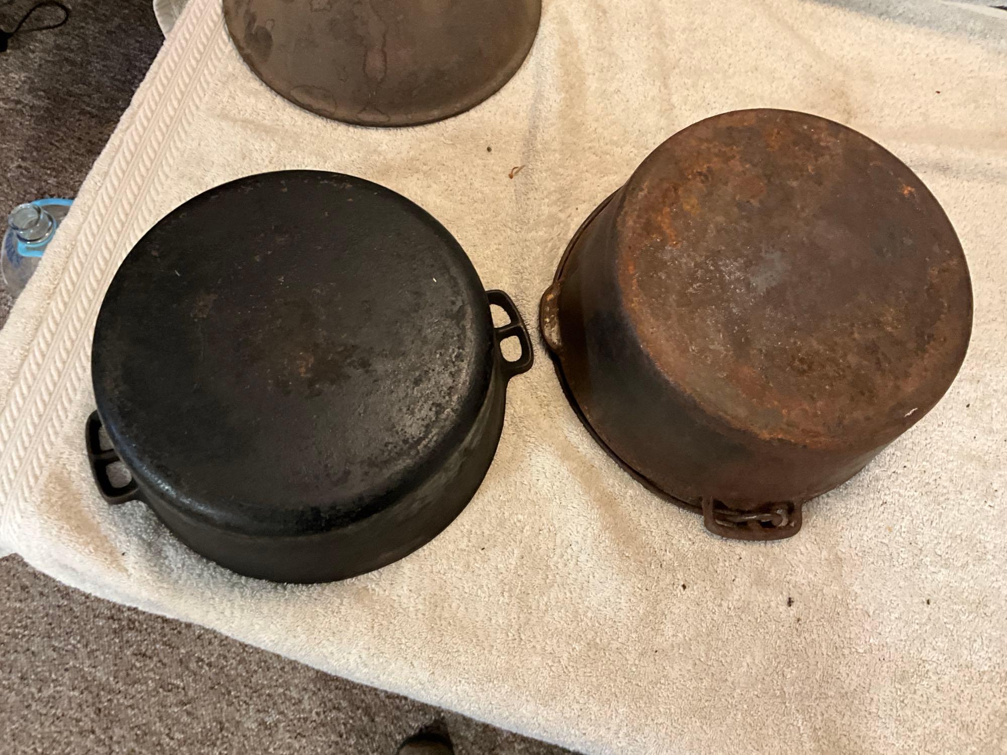 cast iron trivet, & (2) Dutch ovens, (1) lid missing