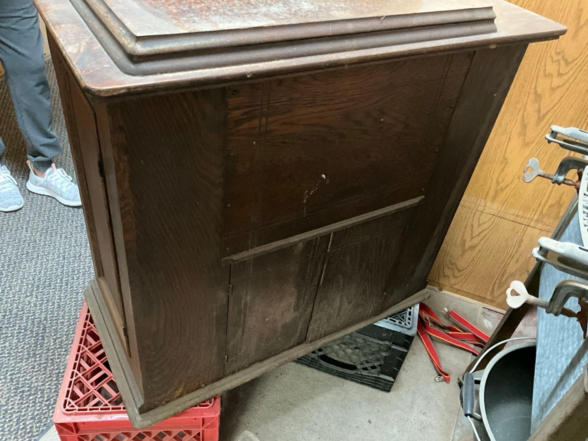 Singer Treadle sewing machine in oak cabinet