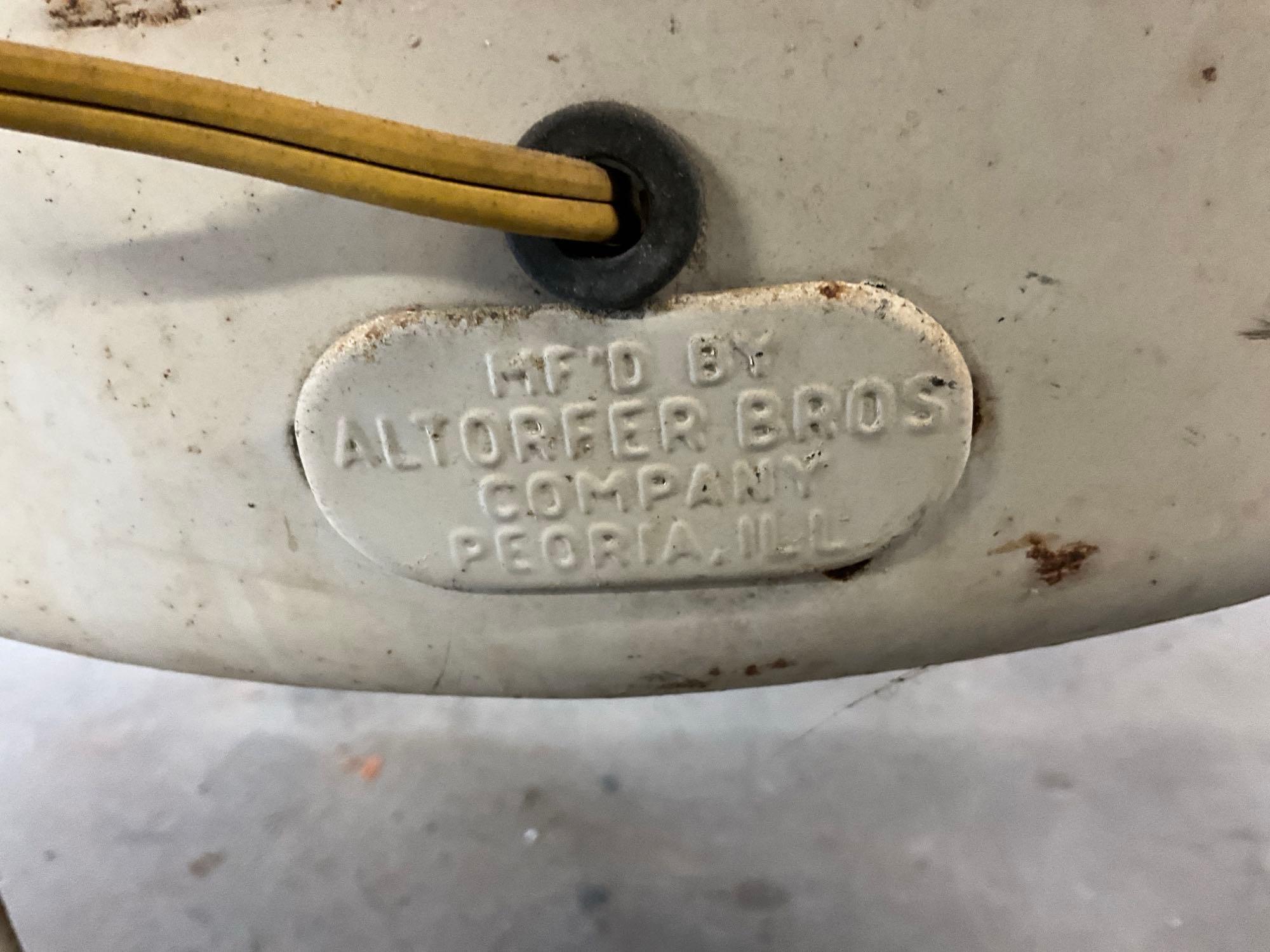 Altorfer Bros Co, Peoria, IL wringer washing machine on rollers