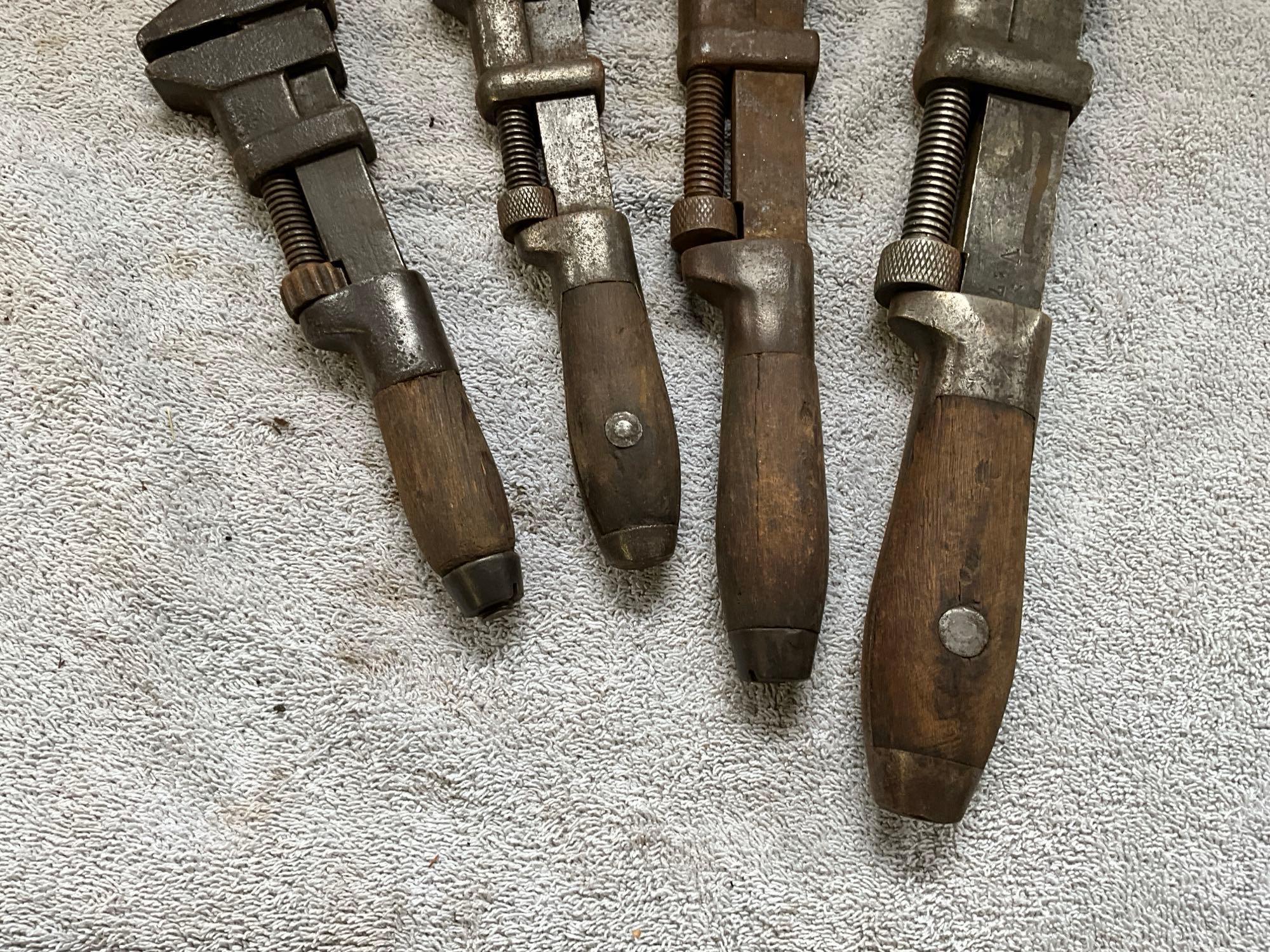 (4) antique adjustable wrenches