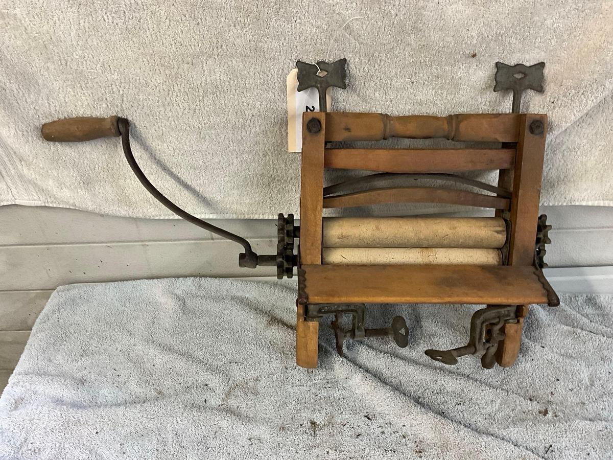 unmarked primitive wash tub wringer,