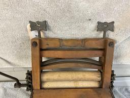 unmarked primitive wash tub wringer,