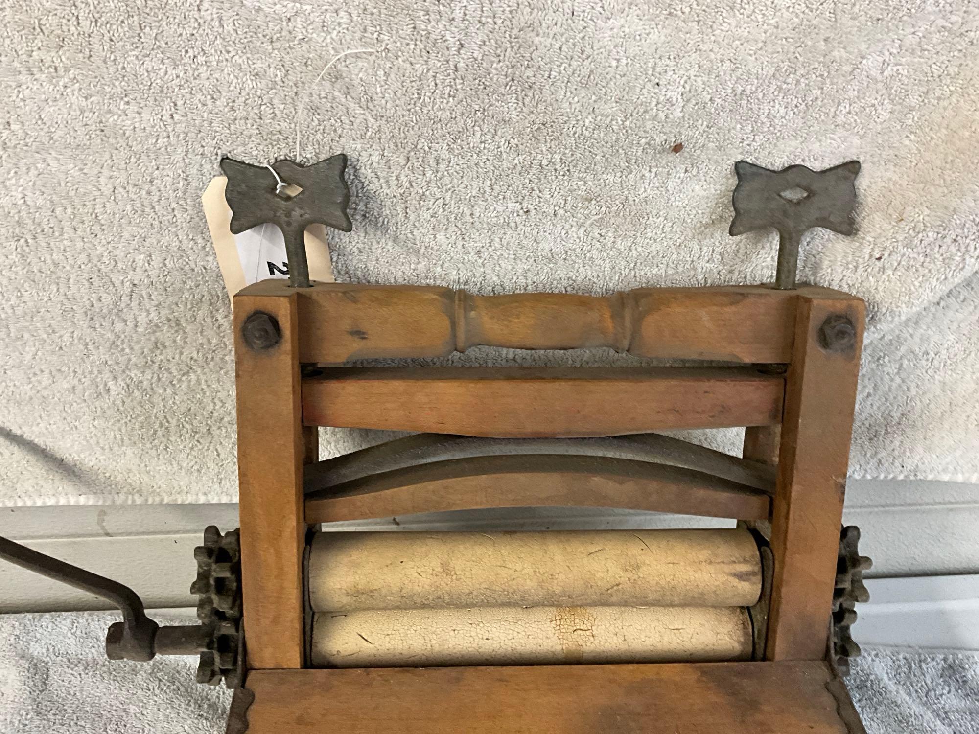 unmarked primitive wash tub wringer,