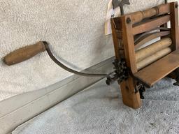 unmarked primitive wash tub wringer,