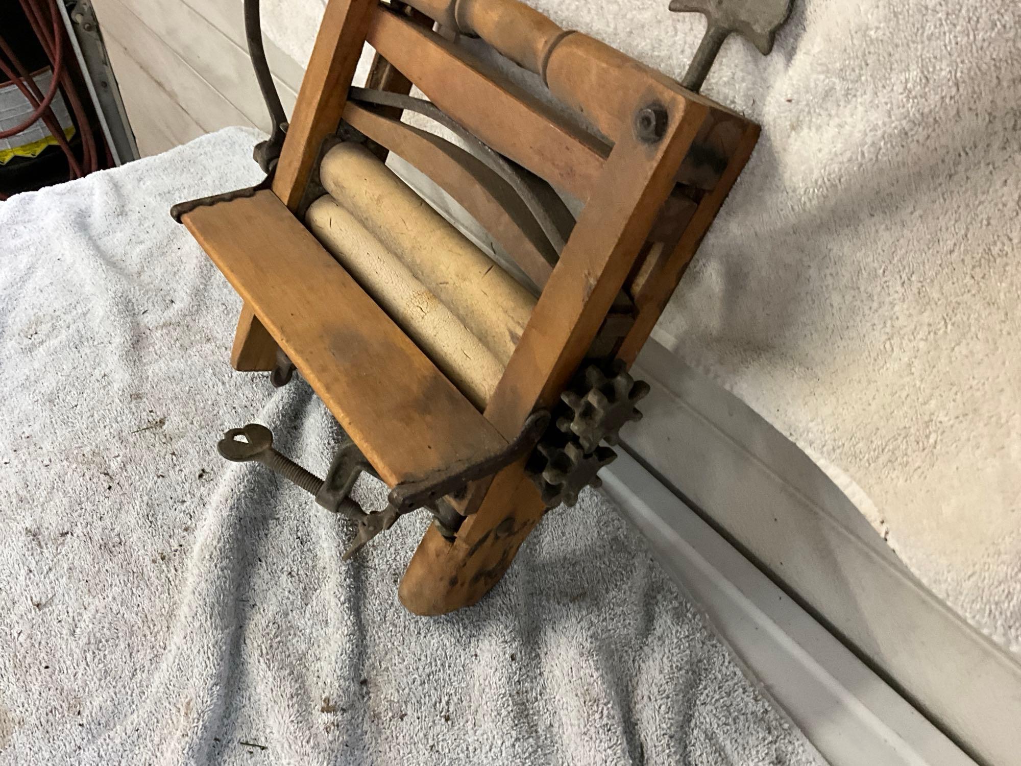 unmarked primitive wash tub wringer,
