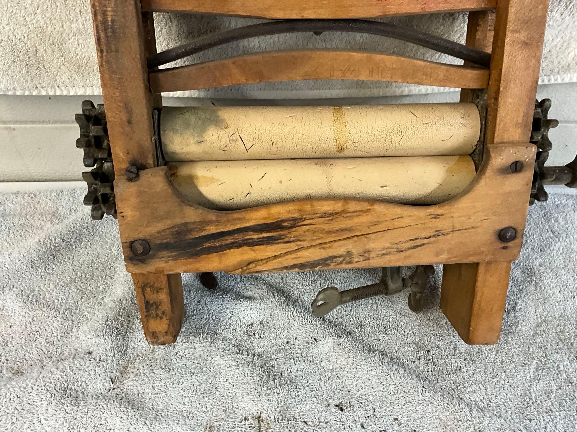 unmarked primitive wash tub wringer,