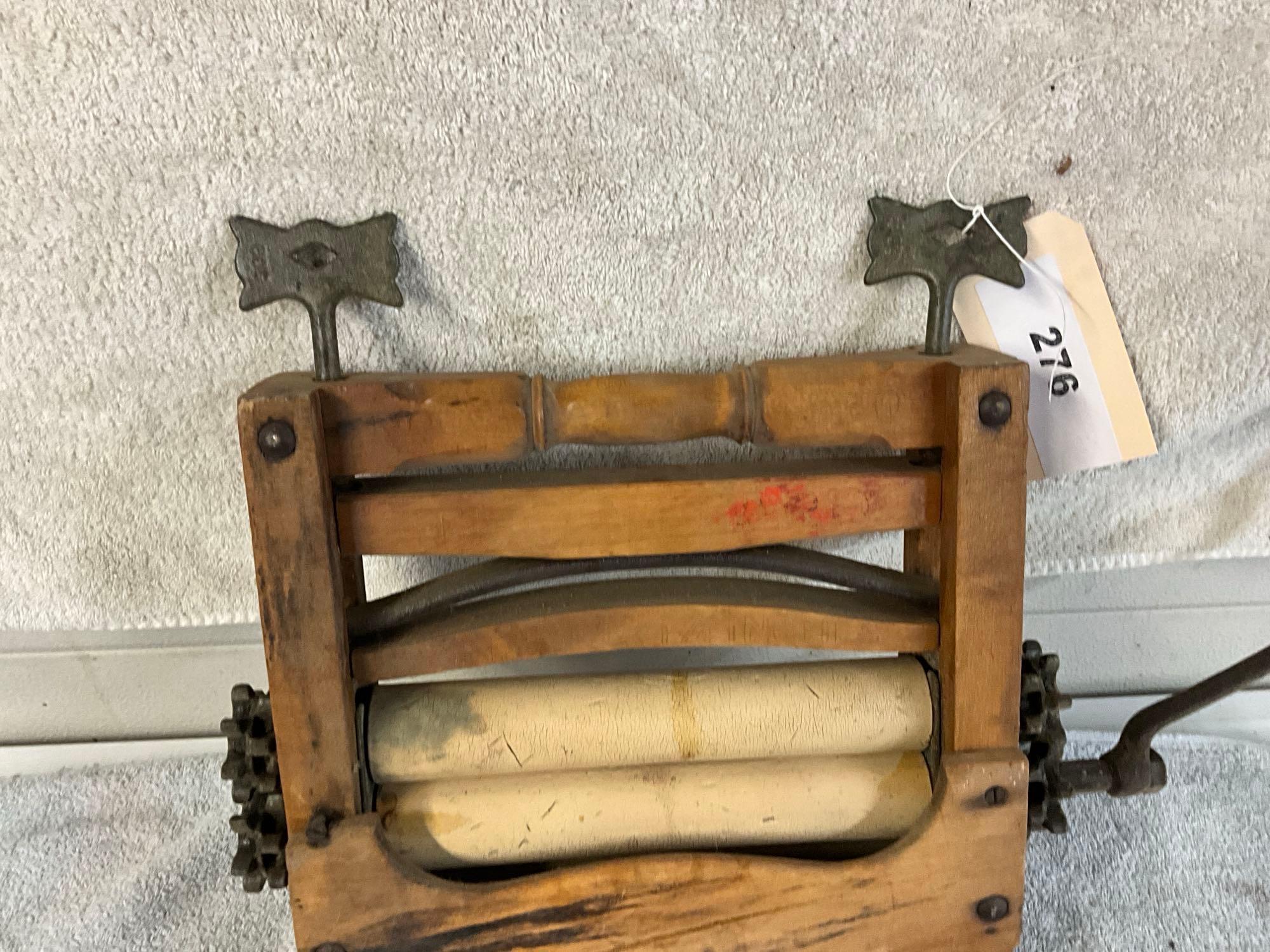 unmarked primitive wash tub wringer,