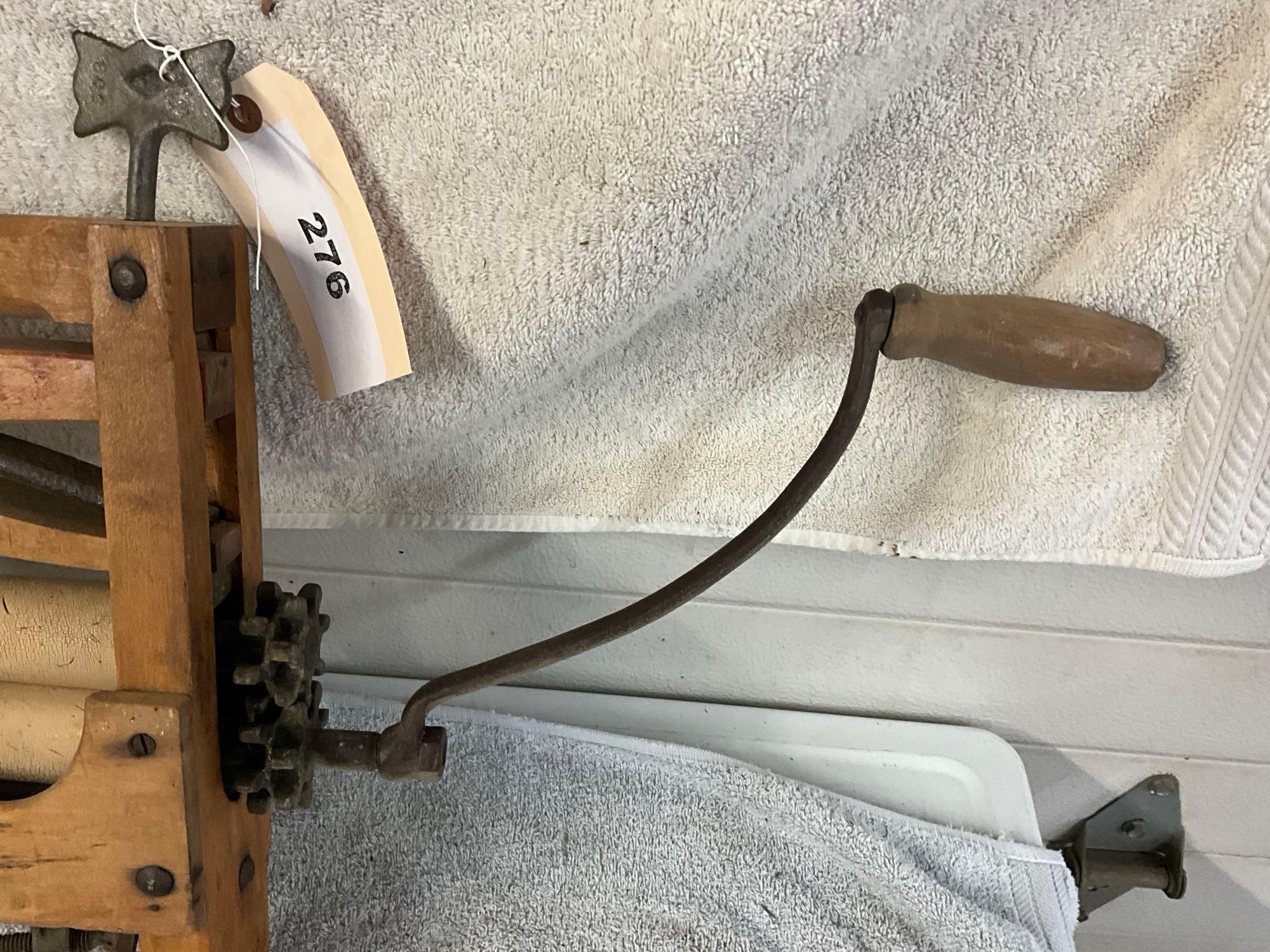 unmarked primitive wash tub wringer,