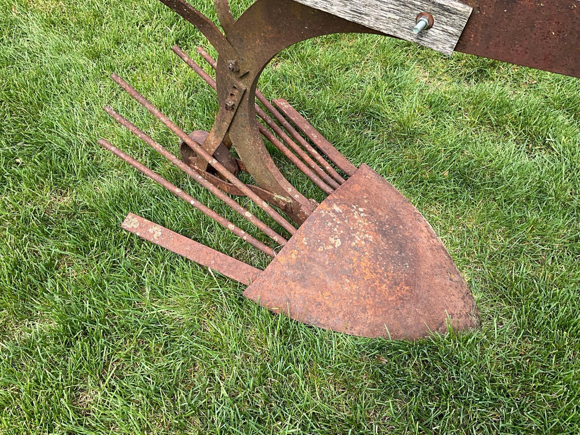 Early horse drawn potato plow