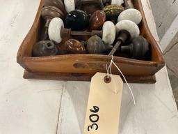 Wooden tray of vintage porcelain and metal door knobs