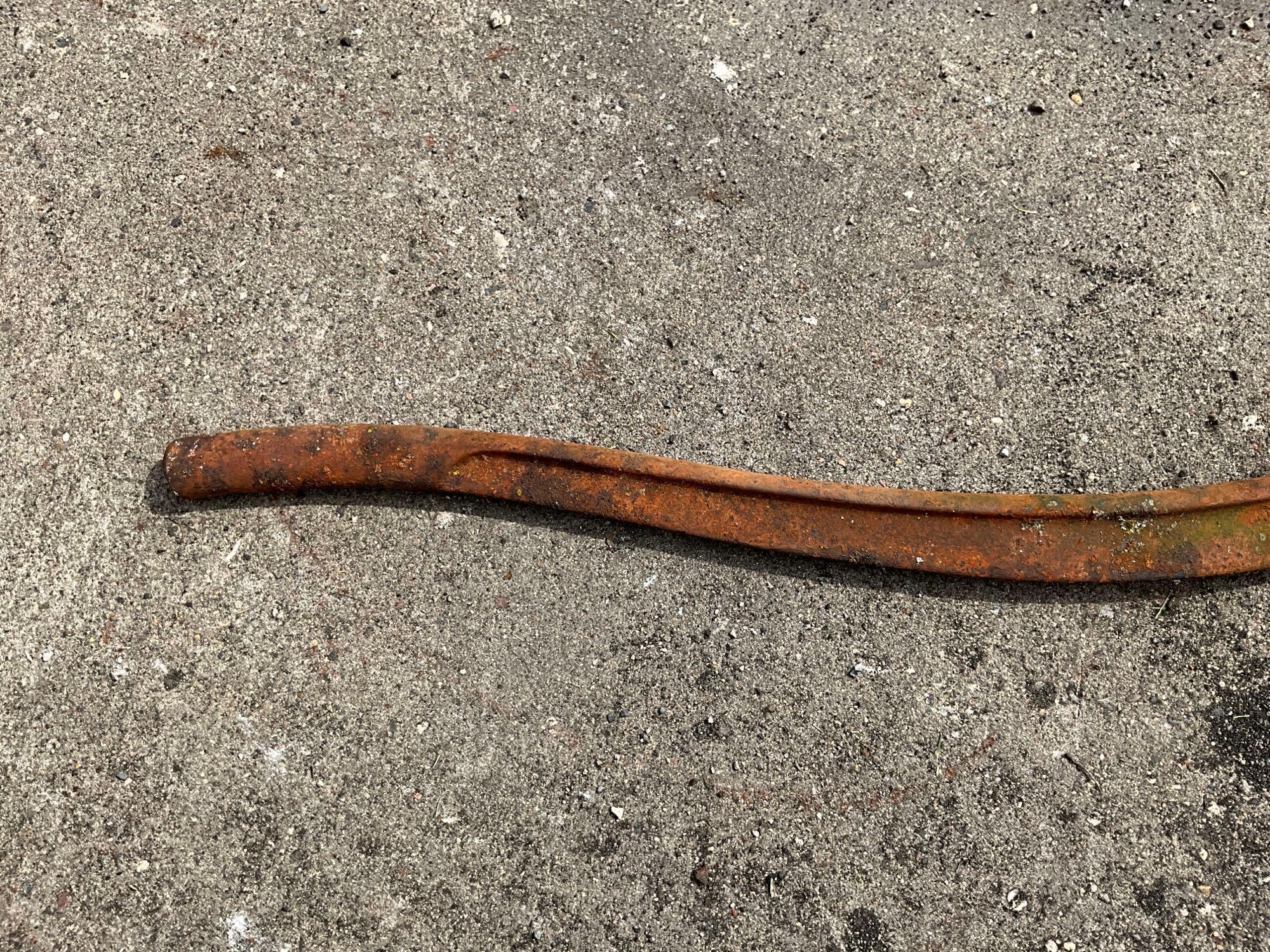 Wood handled scythe and iron pump handle