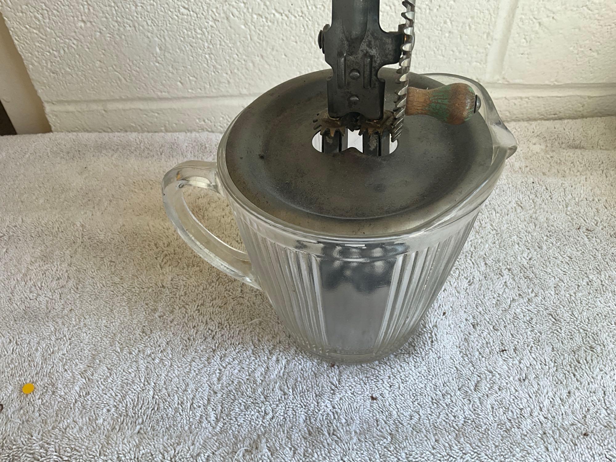 unmarked coffee grinder & glass pitcher w/kitchen mixer