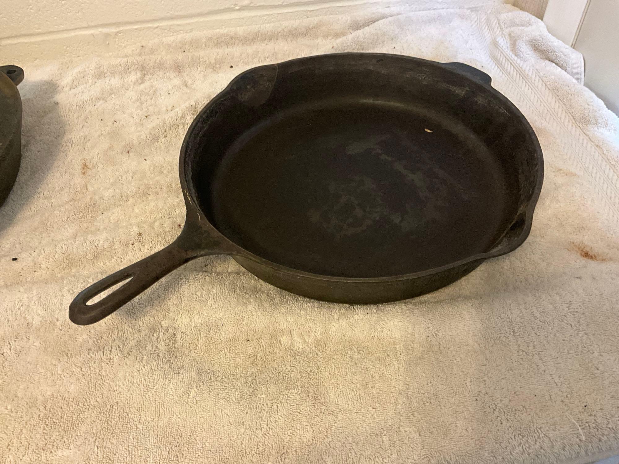 (2) unmarked USA cast iron skillets