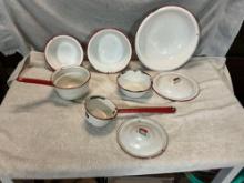 white w/red enamel bowls, pans w/lids, & ladle