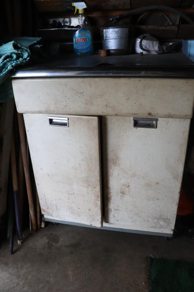 Primitive metal cabinet on wheels