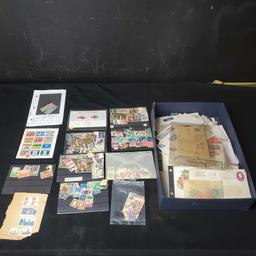 box of stamps and stamped envelopes from around the world