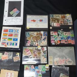 box of stamps and stamped envelopes from around the world
