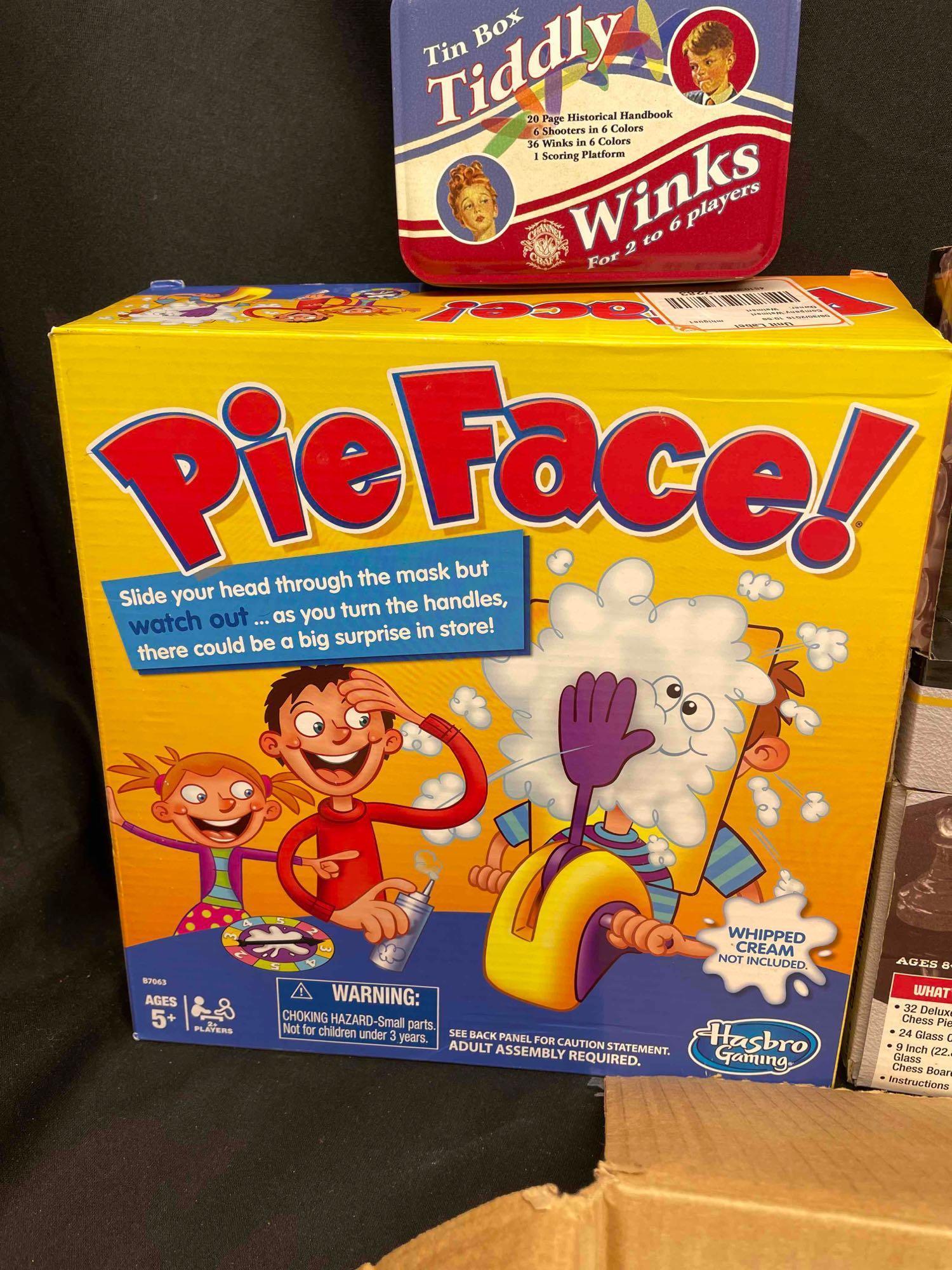 Bin Full of Assorted Games. Glass chess Boards, Pie Face, Helicopter Model, Tiddly Winks,more