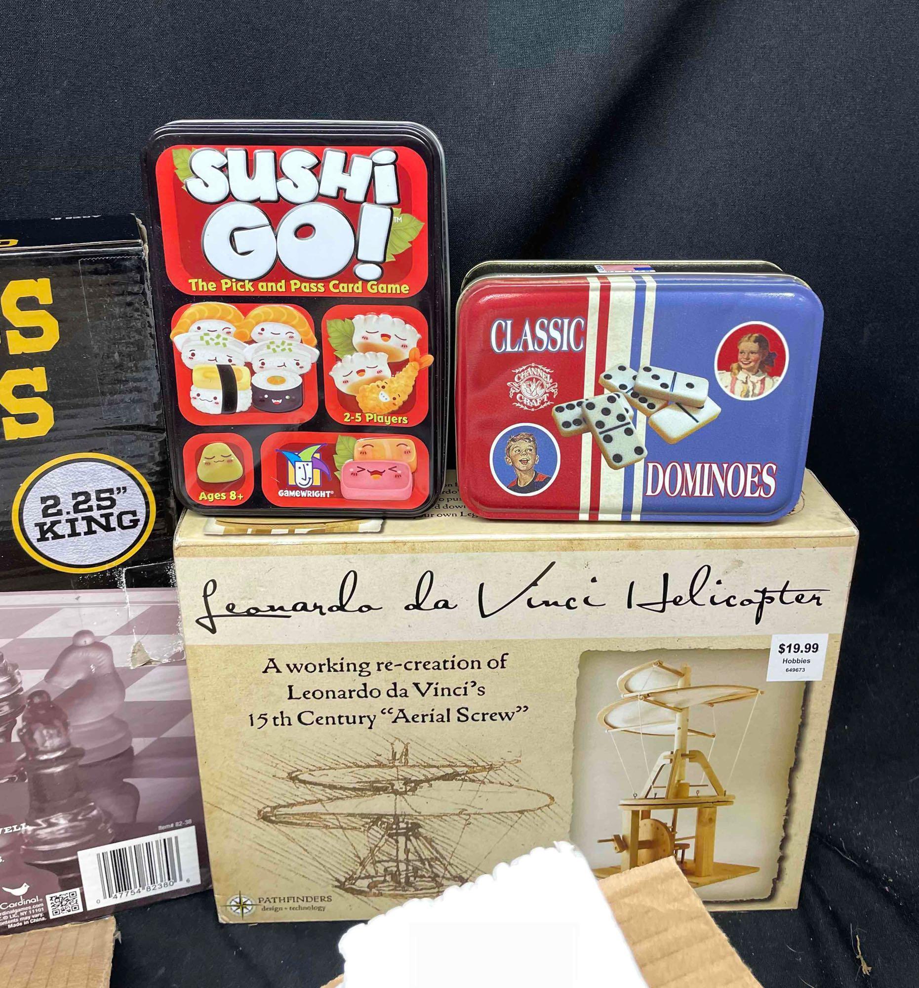 Bin Full of Assorted Games. Glass chess Boards, Pie Face, Helicopter Model, Tiddly Winks,more