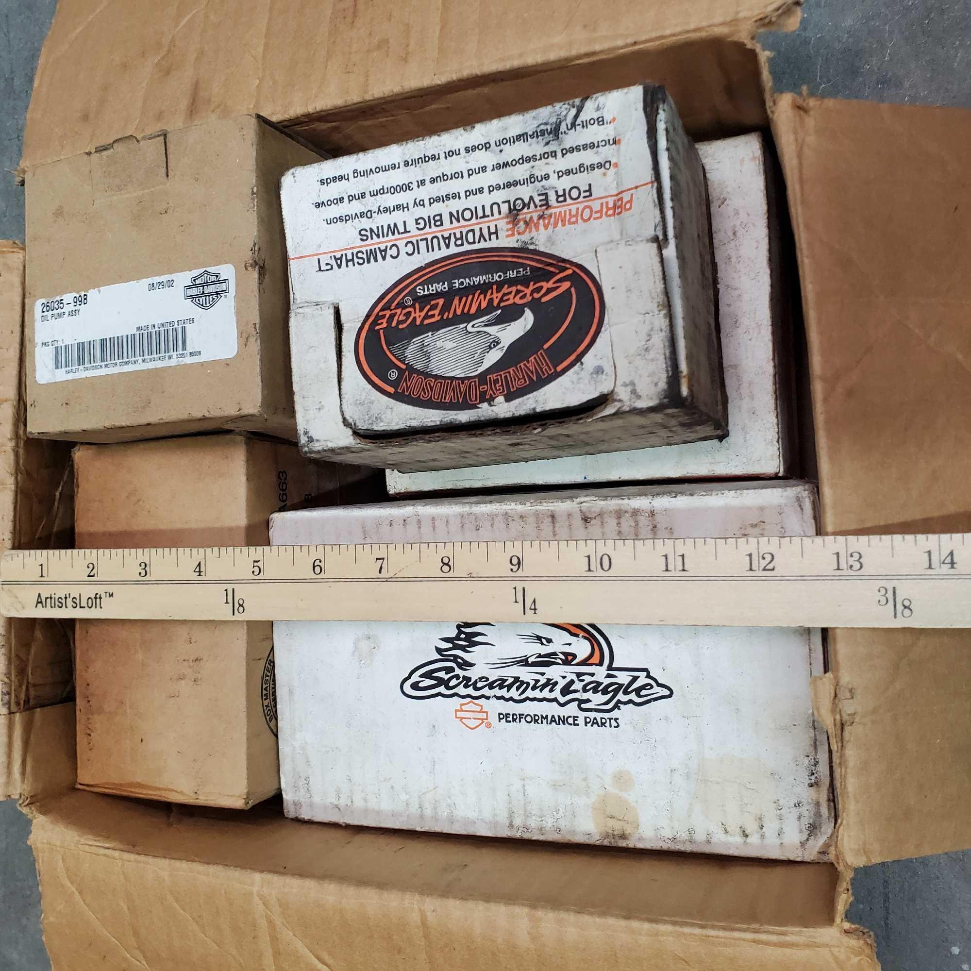 Box of misc.Harley Davidson parts piston kit cam kit oil pump assyrocker arm support kit more