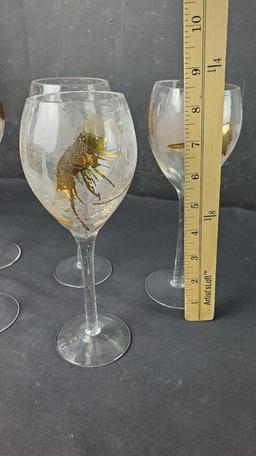 Lot of 7 crystal with gold colered wine glasses