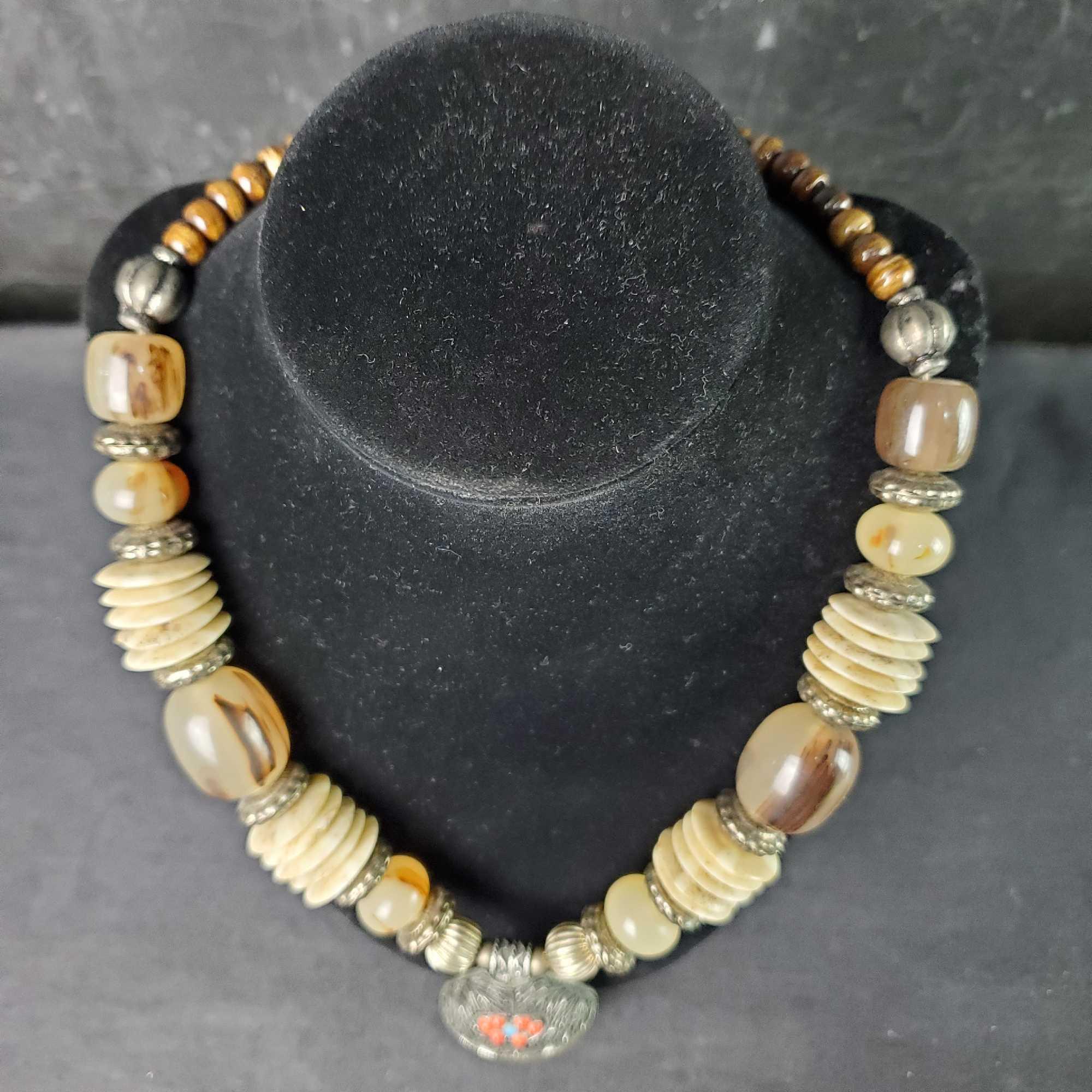 Unique beaded and shell disc necklace with large stone like pendant