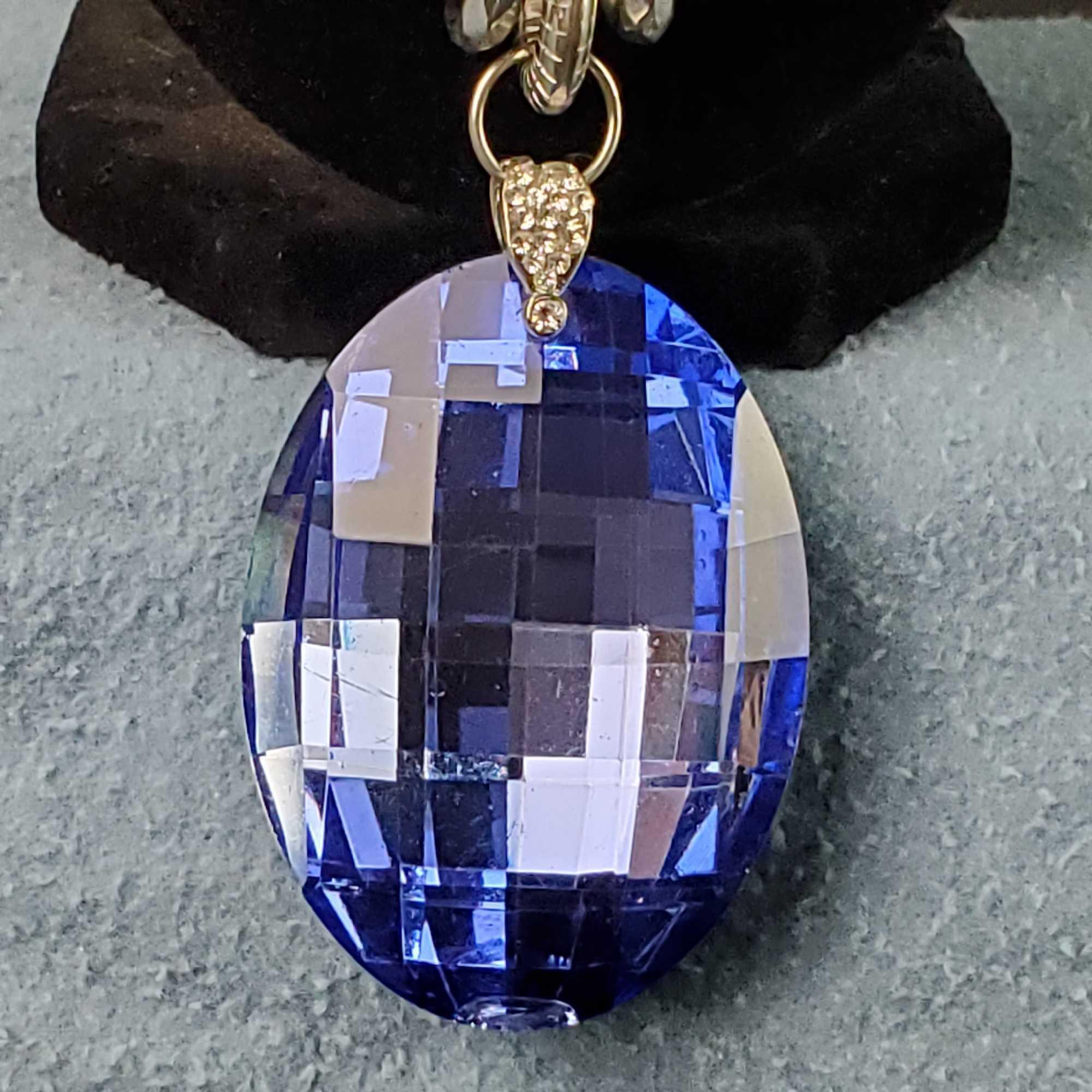 Unique silver tone necklace with large flashy blue pendant