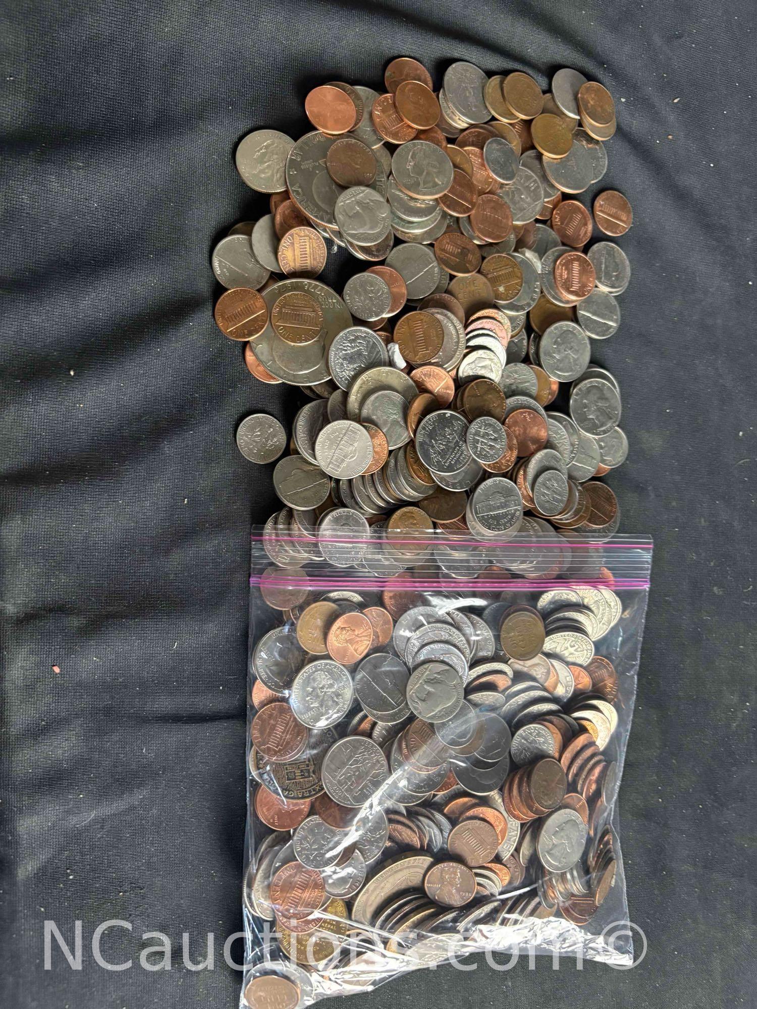 over 4 pounds of US Pennies dimes nickels, quarters dollars.