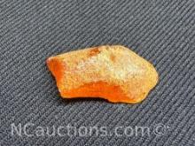 Amber piece 1.12 grams. Quarter for size reference only.