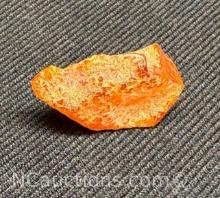 Amber piece 1.08 grams. Quarter for size reference only.